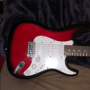Red and White Electric Guitar